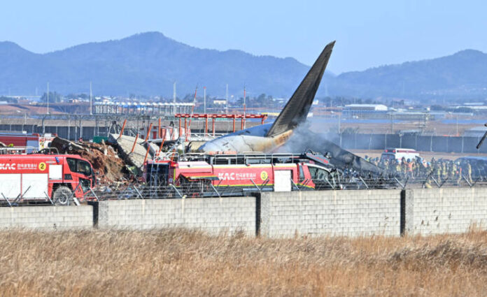 PhotoFlash | All 181 people aboard crashed S. Korean airplane believed killed, except 2 rescued